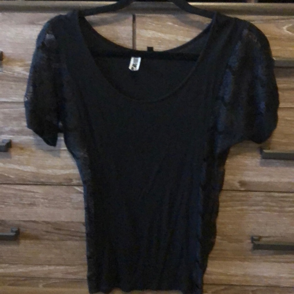 Black top with lace in the sleeves and  sides.